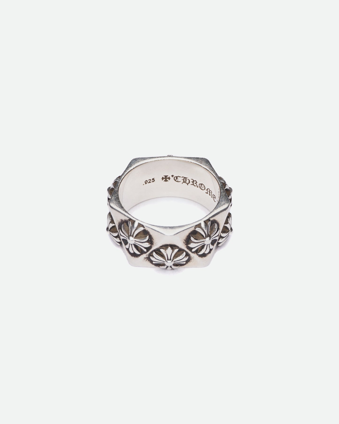 There is a Chrome Hearts Pentagon Plus Ring on white background pictured froom the top.