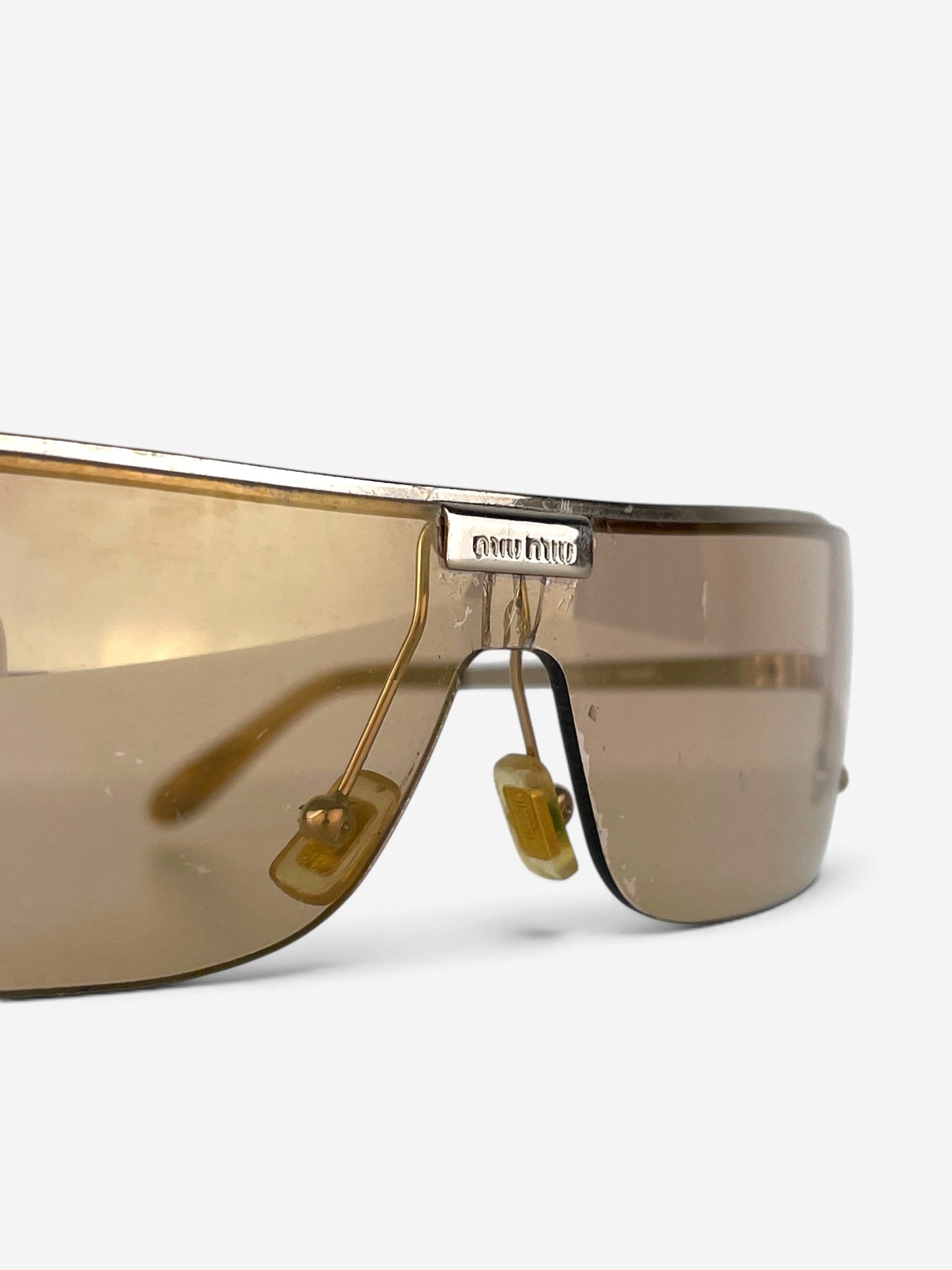 Miu Miu 2000s Rimless Shield Mask Wrap Sunglasses – logo plaque at the bridge detail